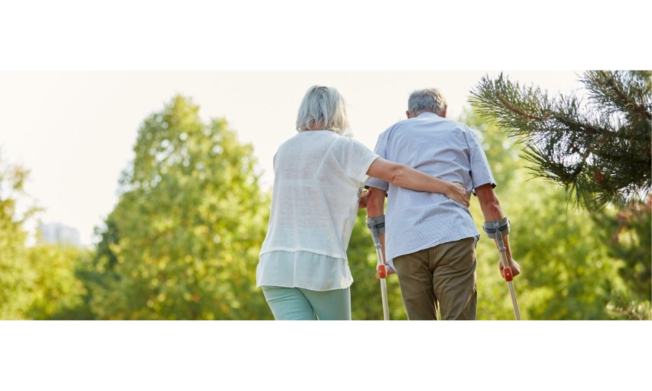 Fall prevention for the elderly while a woman assists a man.