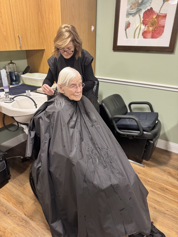 resident getting her hair cut