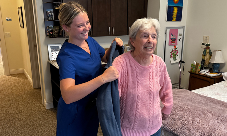 nurse assisting patient