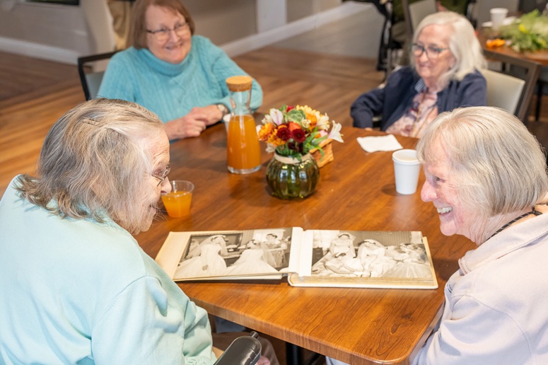 women looking at photos